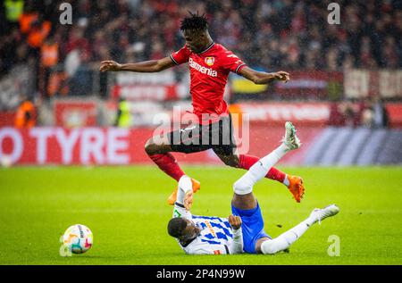 Leverkusen, Germany. 5th Mar, 2023.  Odilon Kossounou (Leverkusen) Dodi Lukebakio (Hertha) Bayer Leverkusen - Hertha BSC Berlin Bundesliga 05.03.2023 Stock Photo