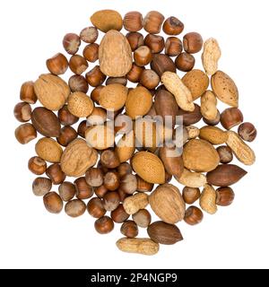 Assorted mix of nuts in shells arranged in a circle Stock Photo