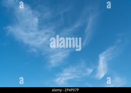 beautiful blue sky with some floating whispy clouds. Stock Photo