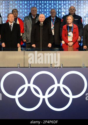 Russian President Vladimir Putin, center, declares the 2014 Winter Olympics open during the opening ceremony, Friday, Feb. 7, 2014, in Sochi, Russia. To Putin's left is United Nations Secretary-General Ban Ki-moon and to his right is Russian bobsledder Irina Skvortsova. (AP Photo/Jung Yeon-je, Pool)