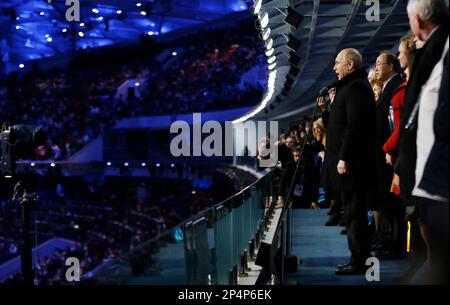 Russian President Vladimir Putin, right, declares the 2014 Winter Olympics open during the opening ceremony, Friday, Feb. 7, 2014, in Sochi, Russia. (AP Photo/David Goldman, Pool)