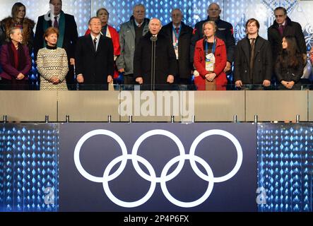 Russian President Vladimir Putin, center, declares the 2014 Winter Olympics open during the opening ceremony, Friday, Feb. 7, 2014, in Sochi, Russia. To Putin's left is United Nations Secretary-General Ban Ki-moon and to his right is Russian bobsledder Irina Skvortsova. (AP Photo/Jung Yeon-je, Pool)