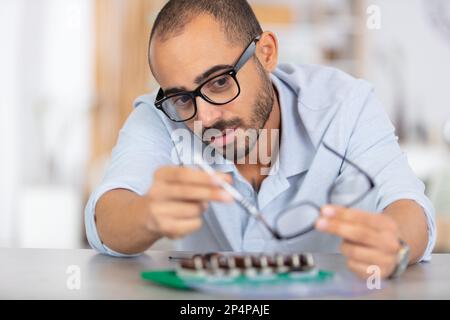 repairman working in technical support fixing computer laptop tr Stock Photo