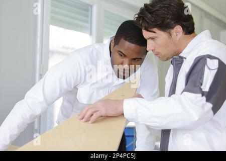 two wood workers in carpentry Stock Photo