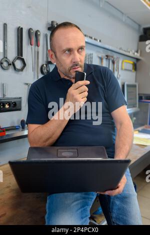 man talking on the phone with the digital voice assistant Stock Photo