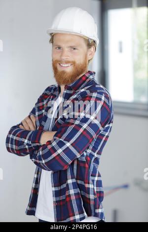 portrait of a bearded builder with his arms crossed Stock Photo