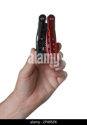 Man holding multitool on white background, closeup Stock Photo