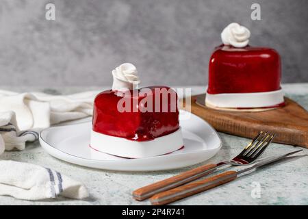 Heart cake. Design cake in heart shape on gray background. Concept Valentines Day, Mothers Day, Birthday. flat lay Stock Photo