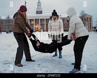 Troy University students Halie Edens, left to right, Brooke Spinks and Sydney Conrad play jump rope using Taylor McGraw as the rope on the campus Tuesday, Jan. 28, 2014 in Troy, Ala. A winter storm that would probably be no big deal in the North all but paralyzed the Deep South on Tuesday, bringing snow, ice and teeth-chattering cold, with temperatures in the teens in some places.(AP Photo/Troy Messenger, Mona Moore)