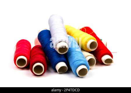 Close up of sewing tools. Red pin cushion with many colorful stick pins and  needles. Short pieces of thread. Metal thimble. All on black background  Stock Photo - Alamy