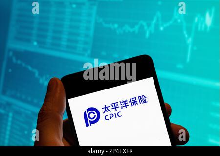 China. 15th Feb, 2023. In this photo illustration, the Chinese insurance company China Pacific Insurance (CPIC) logo is seen displayed on a smartphone with an economic stock exchange index graph in the background. (Credit Image: © Budrul Chukrut/SOPA Images via ZUMA Press Wire) EDITORIAL USAGE ONLY! Not for Commercial USAGE! Stock Photo