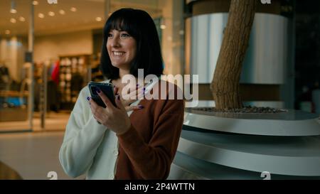 Happy amazed woman female girl win with mobile phone bet browsing, winning celebrating cellphone success triumph chatting communication with Stock Photo