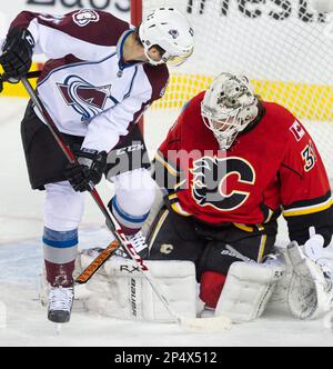 Colorado Avalanche's Ian Laperriere, left, collides with Calgary