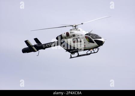 A McDonnell Douglas MD-900 helicopter of Kent Surrey Sussex Air Ambulance arriving at Redhill Aerodrome Surrey England Stock Photo