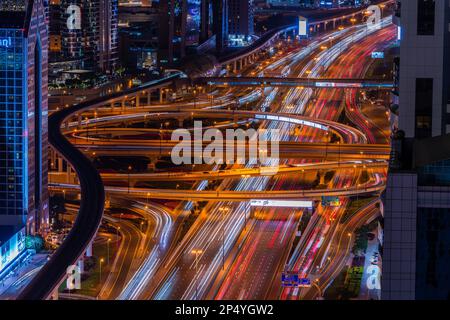 Busy rush hour traffic on one of the spaghetti junctions on Sheikh Zayed Road in Dubai, UAE Stock Photo