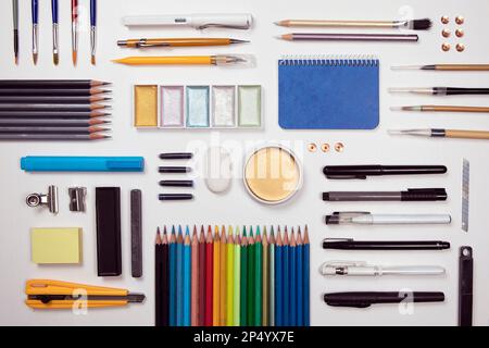 Designer work tools flat lay composition on white background. Painting, sketching, drawing activity, prepared work space. Objects as watercolors, pain Stock Photo