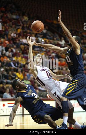 West Virginia's Devin Williams (5) looks to shoot during the second half of  an NCAA college basketball game Monday, Dec. 2, 2013, in Morgantown, W.Va. West  Virginia won 96-47. (AP Photo/Andrew Ferguson