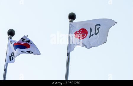 South Korean flag with LG Group's flag in headquarters of LG Twin Towers building at Seoul. LG Group is a South Korean multinational conglomerate founded by Koo In-hwoi and managed by successive generations of his family. It is the fourth-largest chaebol in South Korea. Its headquarters are in the LG Twin Towers building in Seoul. LG makes electronics, chemicals, and telecommunications products and operates subsidiaries such as LG Electronics, Zenith, LG Display, LG Uplus, LG Innotek, LG Chem, and LG Energy Solution in over 80 countries. (Photo by Kim Jae-Hwan/SOPA Images/Sipa USA) Stock Photo