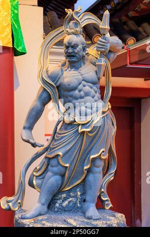 Nio Guhyapāda (guardian) at the front entrance of the Buddha Tooth Relic Temple, Chinatown, Singapore Stock Photo