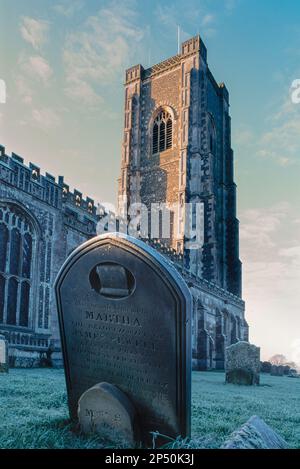 English churchyard, view in winter of the churchyard of the Church of St Peter and St Paul in the Suffolk village of Lavenham, England, UK Stock Photo