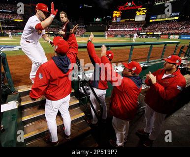 The Boston Red Sox, including from left A.J. Pierzynski, Koji Uehara, David  Ortiz and manager John Farrell celebrate after defeating the Minnesota Twins  1-0 in a baseball game in Boston, Monday, June