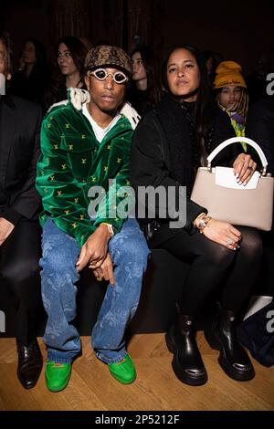Helen Lasichanh, from left, Rocket Ayer Williams and Pharrell Williams  arrive for the Off-White Ready To Wear Fall/Winter 2022-2023 fashion  collection, unveiled during the Fashion Week in Paris, Monday, Feb. 28,  2022. (