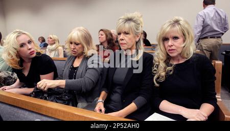 Family members of Michele McNeill listen to testimony as defendant