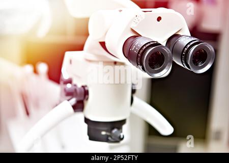 Dental surgery microscope and doctor Stock Photo