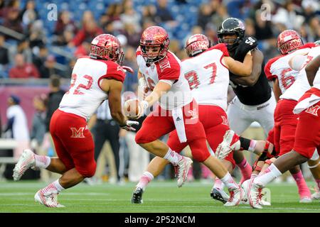 Miami Ohio running back Austin Sykes (29) is brought down by Akron  defensive back Davanzo Tate (5) in the first quarter during their football  game Wednesday, Nov. 14, 2007, in Oxford, Ohio. (