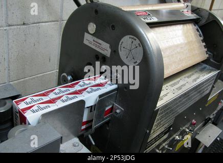 minneapolis tobacco tax This July 29, 2013, photo shows cigarette stamp machines at M. Amundson  Cigar & Candy Co. in Minneapolis. Minnesota's tax increase on cigarettes  has dampened sales since taking effect on July 1,