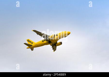 Austin, Texas - February 2023: Airbus A319 passenger jet (registration N532NK) operated by Spirit Airlines climbing after take from the city's airport Stock Photo