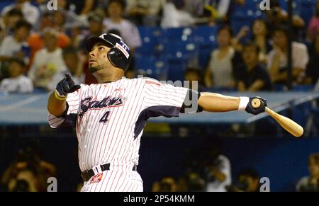 Wladimir Balentien, outfielder of Japanese baseball team Yakult Swallows  holds up a memorial plate after hitting his 56th home run during the ball  game agaisnt the Hanshin Tigers at the Jingu Stadium