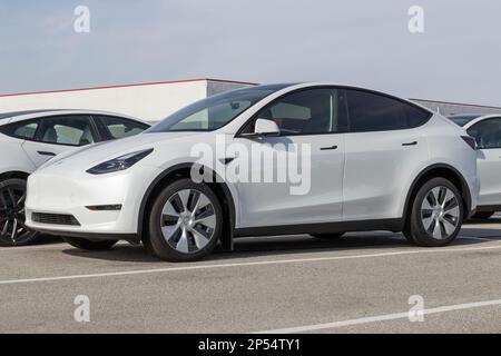 Indianapolis - Circa March 2023: Tesla Model Y display at a dealership. The Tesla Model Y is an all-wheel-drive, 5-passenger, 4-door SUV. Stock Photo