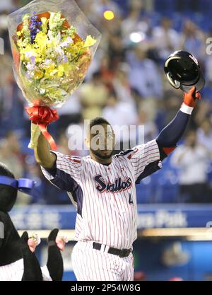 Wladimir Balentien, outfielder of Japanese baseball team Yakult Swallows  holds up a memorial plate after hitting his 56th home run during the ball  game agaisnt the Hanshin Tigers at the Jingu Stadium