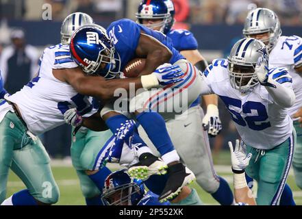 Photo: Dallas Cowboys Gerald Sensabaugh tackles New York Giants Bear Pascoe  at MetLife Stadium in New Jersey - NYP20120101112 