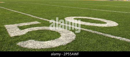 Baltimore Ravens running back Ray Rice looks at the yard marker with New  England Patriots defensive end Rob Ninkovich (50) and strong safety Duron  Harmon (30) on a fourth down play at