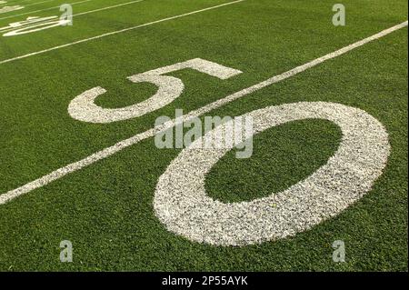 Baltimore Ravens running back Ray Rice looks at the yard marker with New  England Patriots defensive end Rob Ninkovich (50) and strong safety Duron  Harmon (30) on a fourth down play at