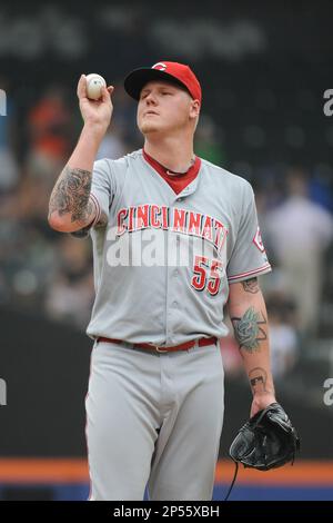 Cincinnati Reds pitcher Mat Latos shows his tattoos as he poses for a  picture during the team's photo day before spring training baseball  workouts Thursday, Feb. 20, 2014, in Goodyear, Ariz. (AP