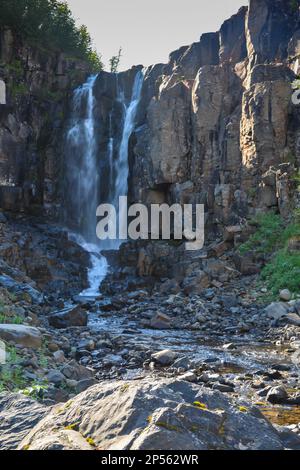 Putorana Plateau, a waterfall on the Grayling Stream. Mountain stream on a  cloudy day Stock Photo - Alamy