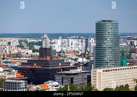 Bratislava, Slovakia - June 19 2018: The National Bank of Slovakia (the tallest skyscraper in the capital) next to the Slovak Radio Building. Stock Photo