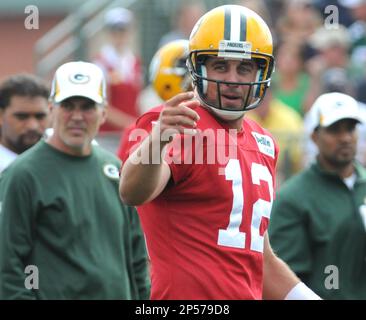 Ray Nitschke of the Green Bay Packers helps young fans sort their