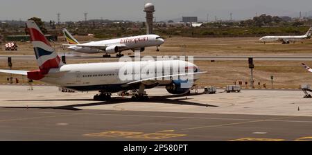 Cape Town, South Africa. 2023. Passenger jet landing on the main runway at CPT International airport..