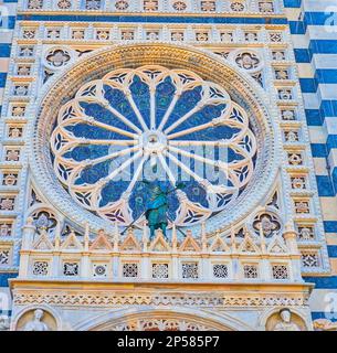 Carved marble facade of Doumo of Monza and large lace rose window, Monza, Italy Stock Photo