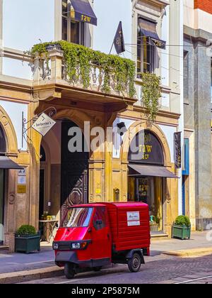 MILAN, ITALY - APRIL 11, 2022: Small three-wheelers scooter stands on Corso Magenta street, on April 11 in Milan, Italy Stock Photo