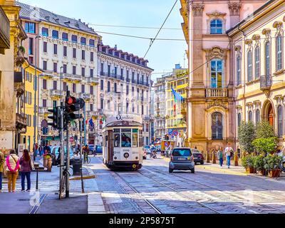 MILAN, ITALY - APRIL 11, 2022: Retro styled tram rides along Corso Magenta street in central neighborhood, on April 11 in Milan, Italy Stock Photo