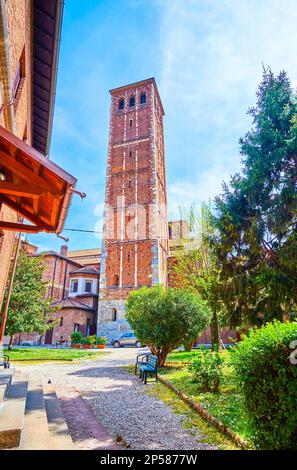 The brick Canons' bell tower of Basilica of Sant'Ambrogio complex in Milan, Italy Stock Photo