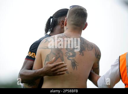 July 13, 2013 - Shrewsbury, Shropshire, United Kingdom - Didier Drogba is confronted by a supporter keen to show off the Drogba tattoo on his back - Football - Pre-season friendly -