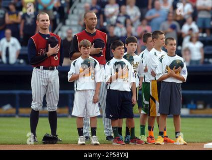 American League All-Stars Derek Jeter, of the New York Yankees, (L) and Max  Scherzer, of the Detroit Tigers, celebrate their 5-3 win over the National  League after the 2014 MLB All Star