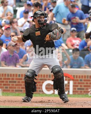 Pittsburgh Pirates' Russell Martin (55) gets a facefull of cream in  celebration from Pittsburgh Pirates' A.J. Burnett after Martin drove in  Gaby Sanchez with the game winning hit in the fourteenth inning