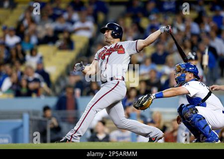 Los Angeles, USA. 8th June, 2013. Atlanta Braves second baseman Dan Uggla  #26 points as he crosses home after hitting a home run in the 5th inning  during the Major League Baseball